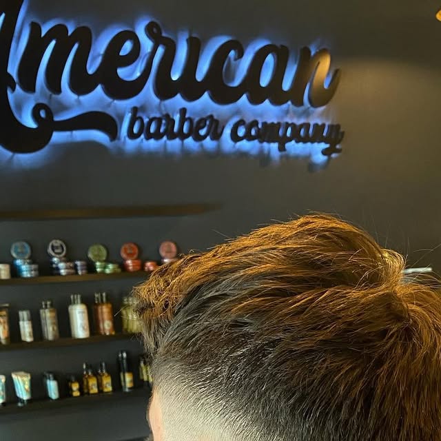 Textured top tapered into the sides, under the American Barber Company sign