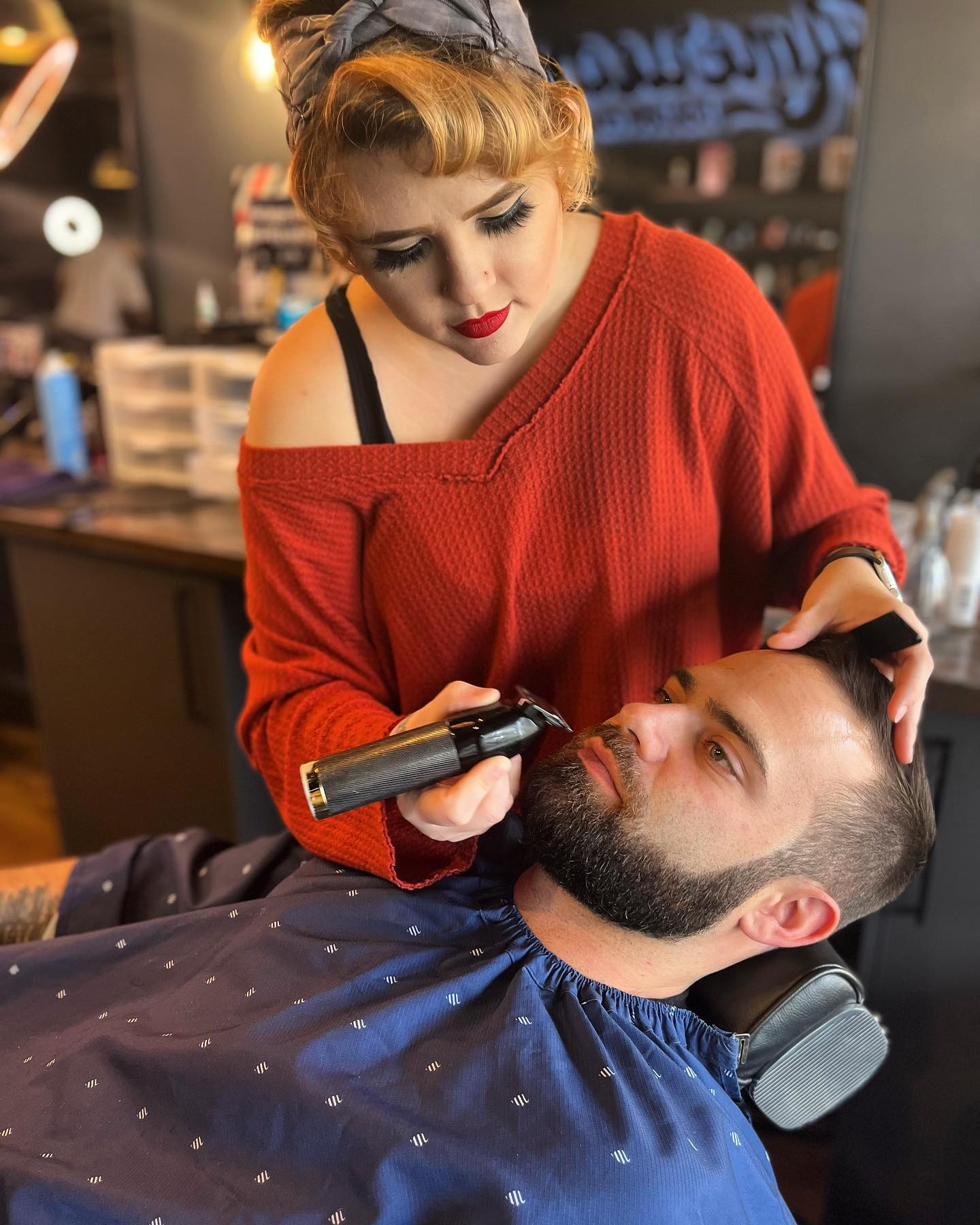 A beard being lined up with clippers in the chair at American Barber Co, Danville